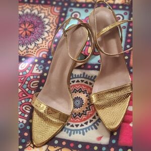 Woman high heel shoes , gold color